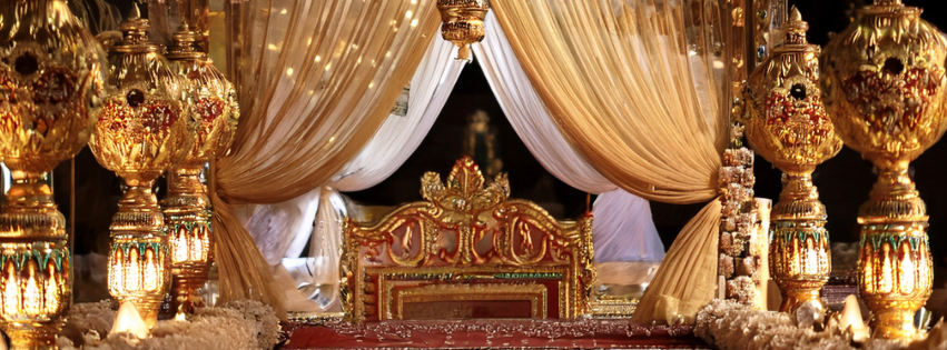 Mumbai wedding reception with crystal chandeliers and modern floral centerpieces