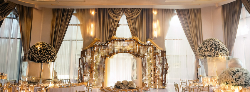 Los Angeles wedding setup with dramatic lighting, florals, and LED floor